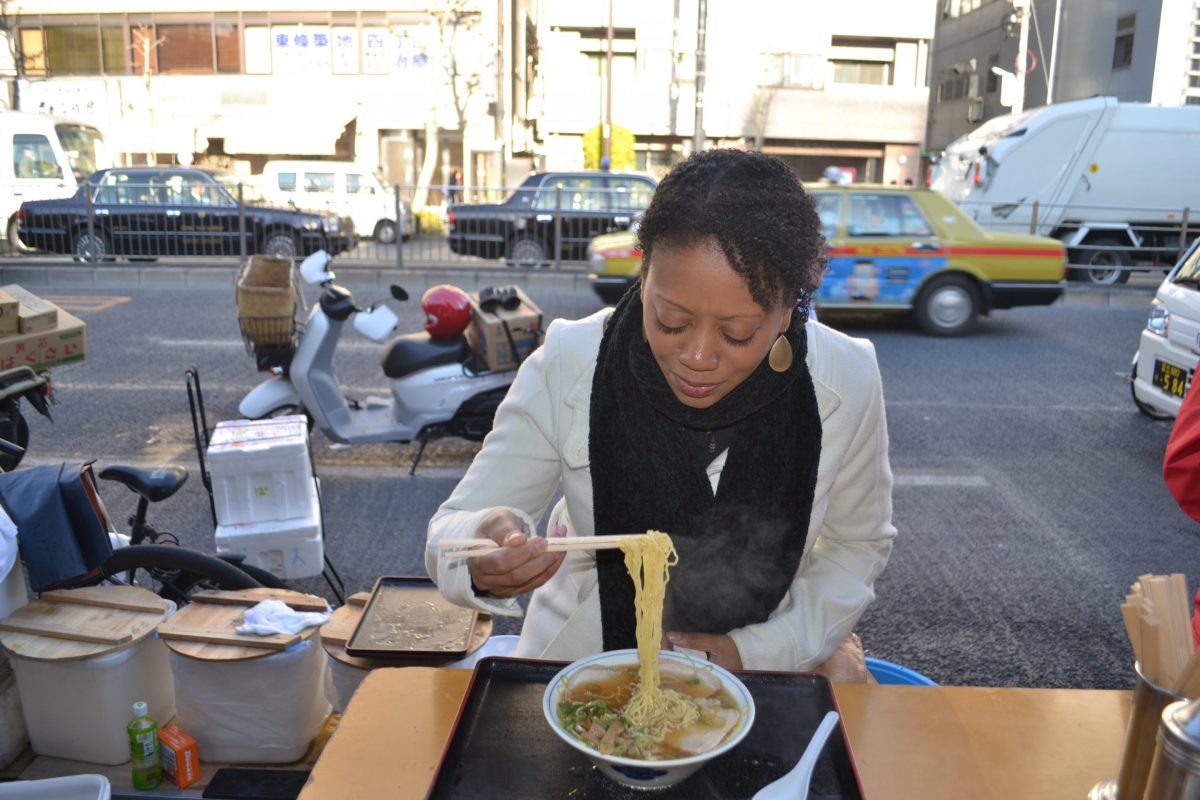 Travel Blogger Mia Herman eating noodles in Japan