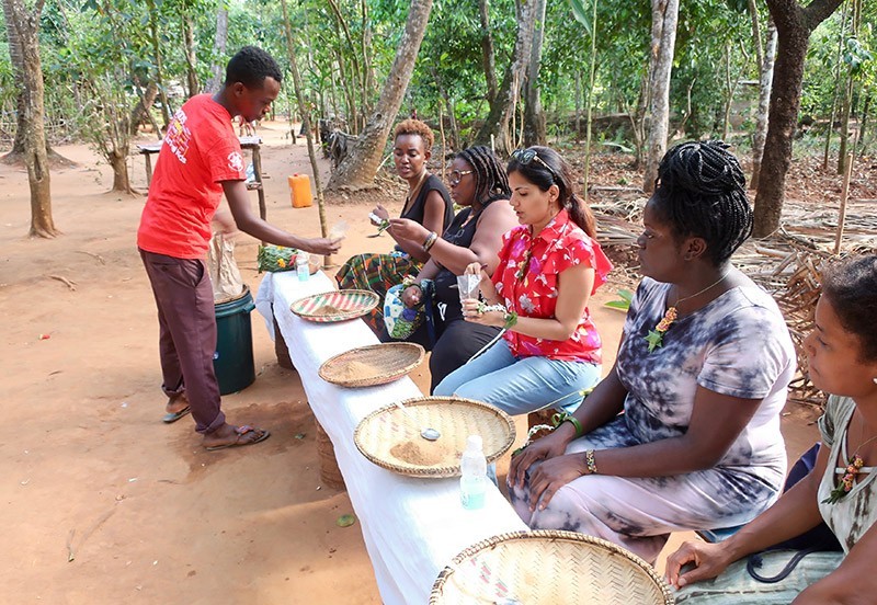 Sucheta Rawal, Grace Odogbili and Go Eat Give travelers on the Jumbo Spice Farm in Tanzania