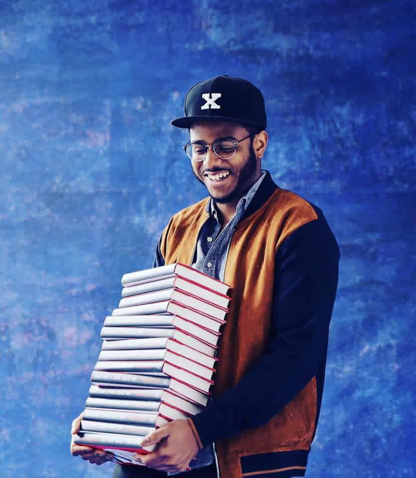 Cuisine Noir Kwame Onwuachi With Arms Full Of Books