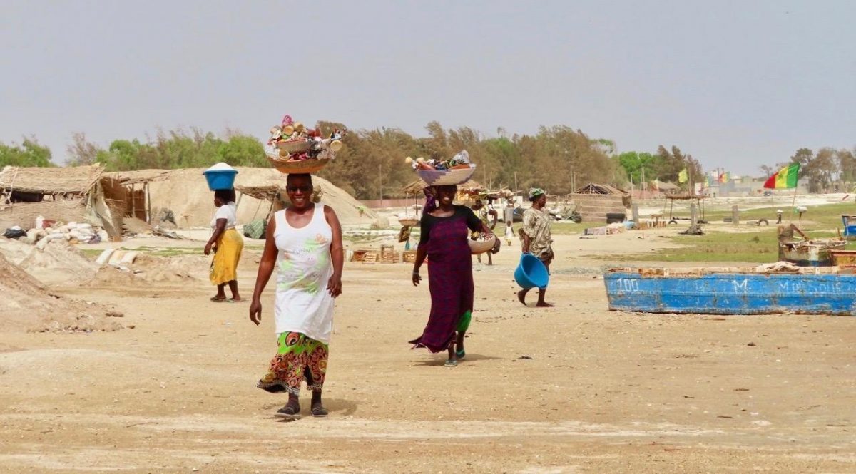 Women in Senegal working around The Pink Lake