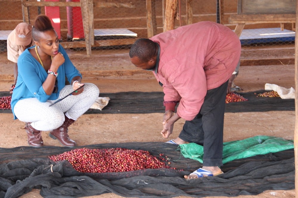 Vava Angwenyi with coffee producers in Kenya