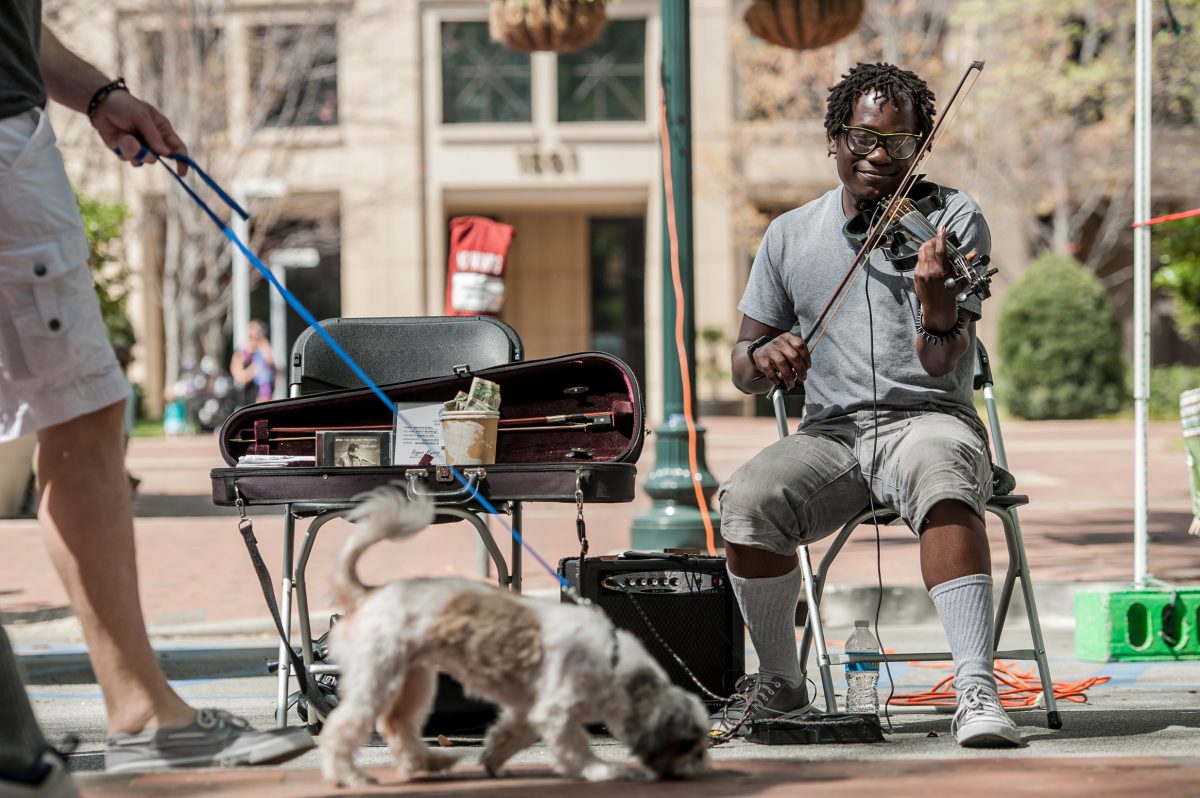 Street artist playing the violin at Soda City Market in Columbia, SC