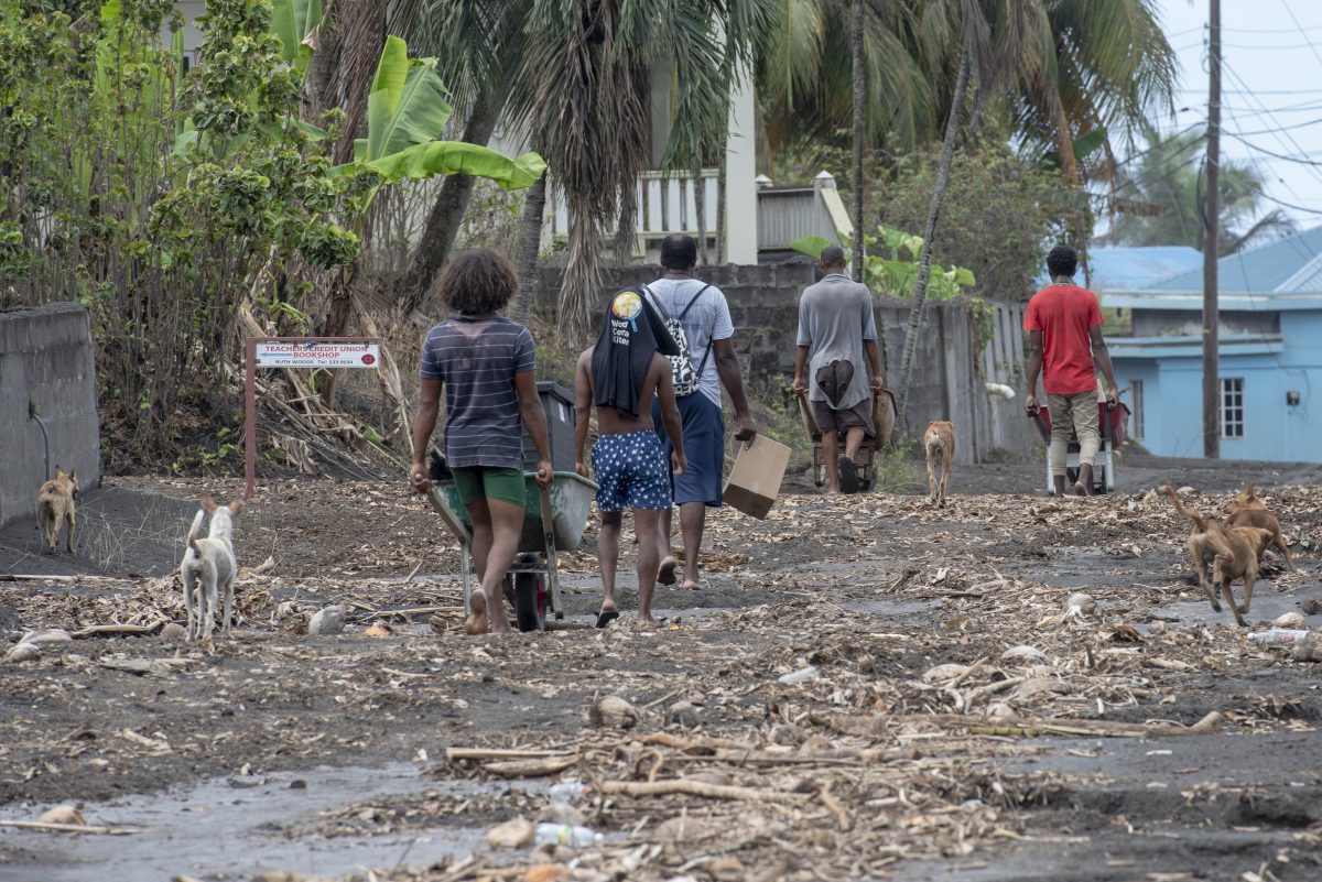 Residents in St. Vincent and The Grenadines walking through the aftermath of the volcano eruption