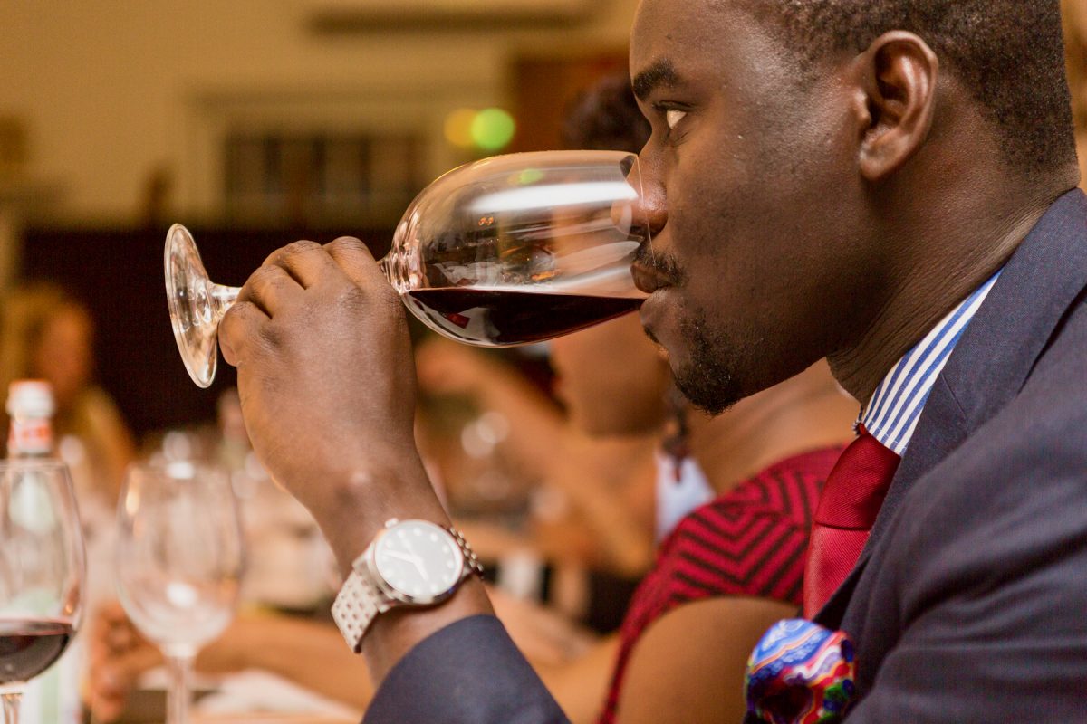 Man attending a wine tasting event at Sai Wine and Champagne Café