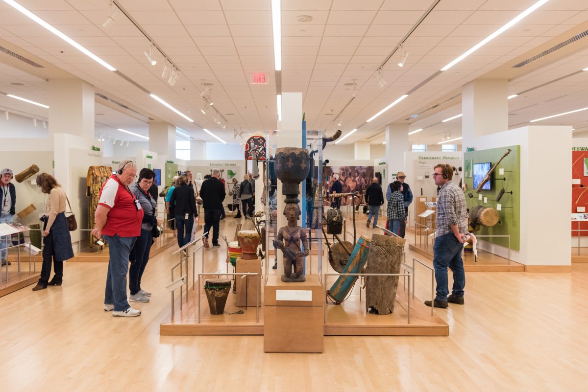 Attendees walking through an exhibit at Musical Instrument Museum