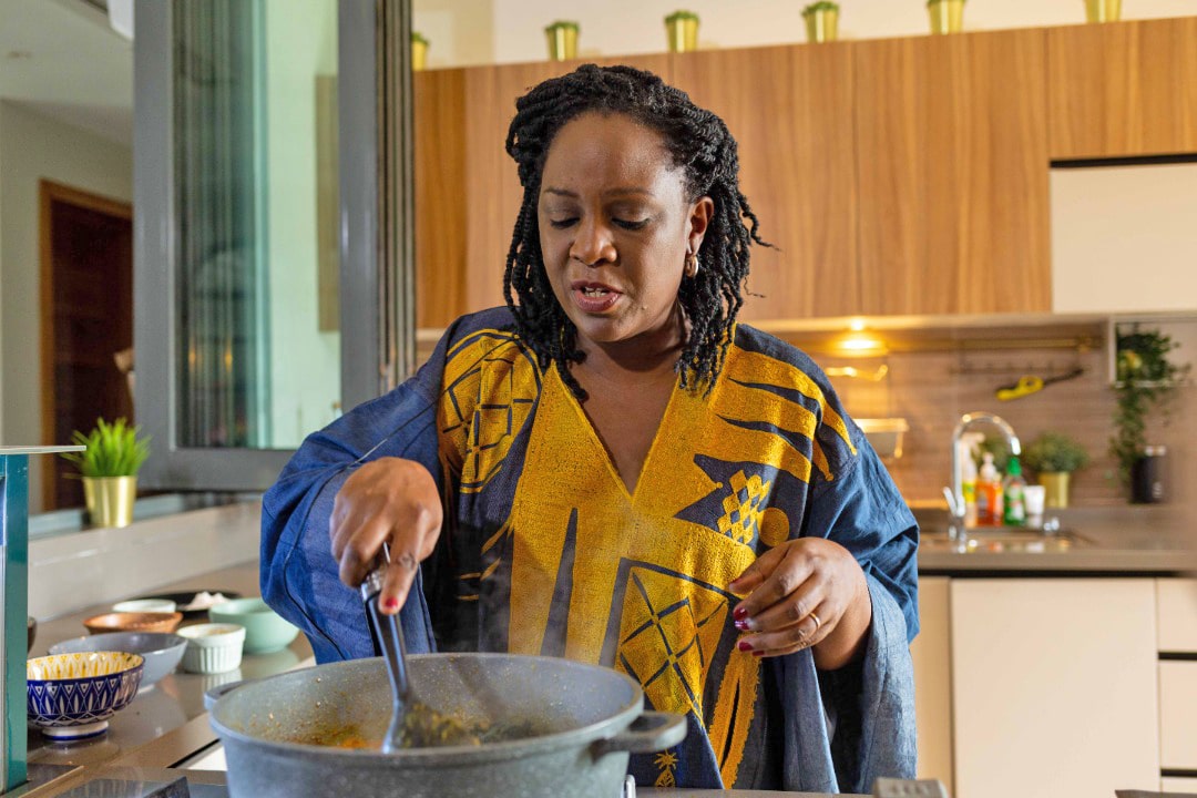 Tola Akerele cooking in her kitchen