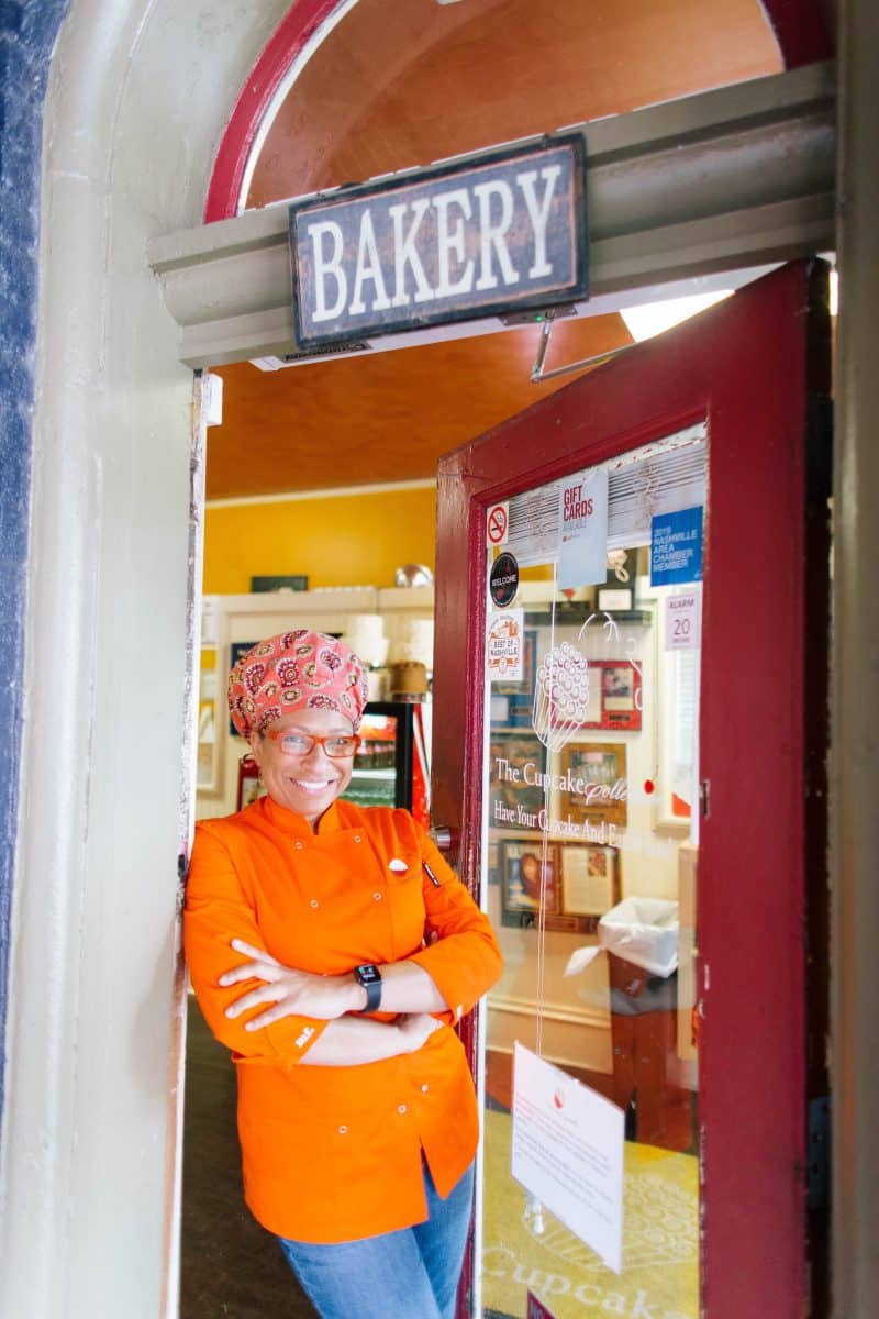 The Cupcake Collection founder Mignon Francois in front of bakery