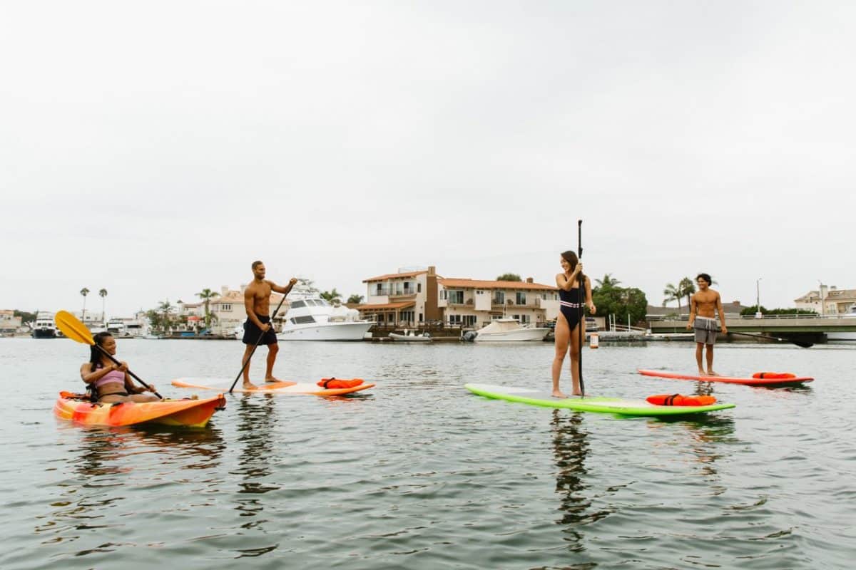 People paddle boarding in Huntington Beach