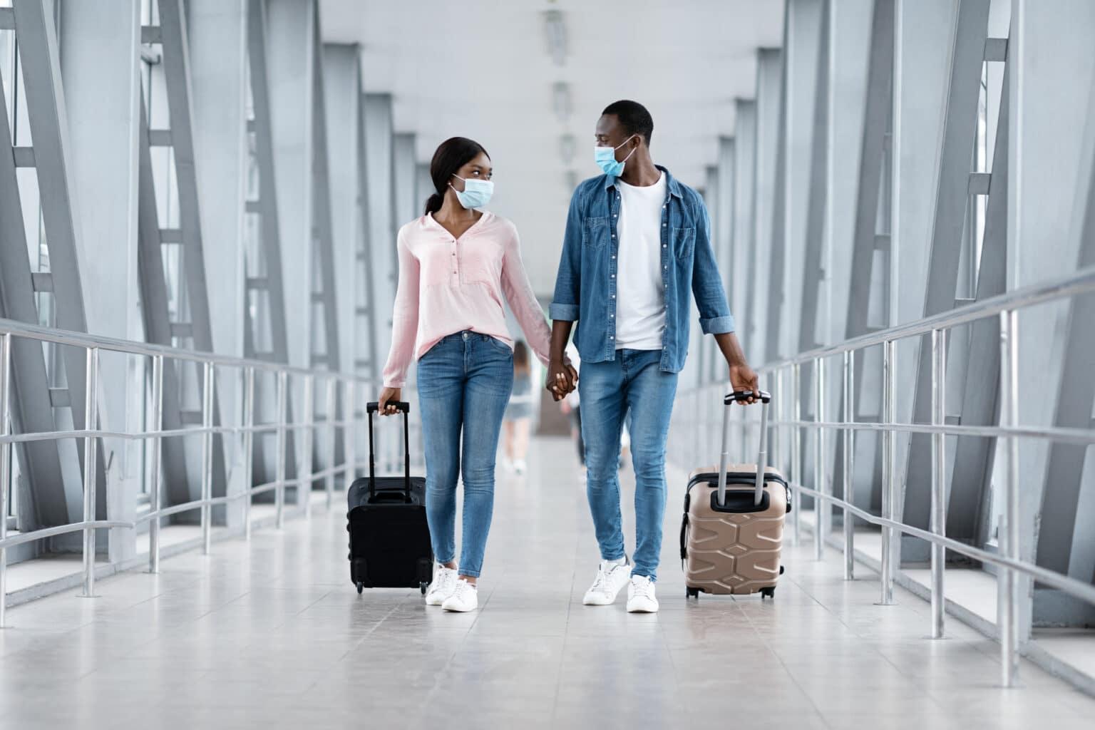 Travel Trends - Couple walking through airport