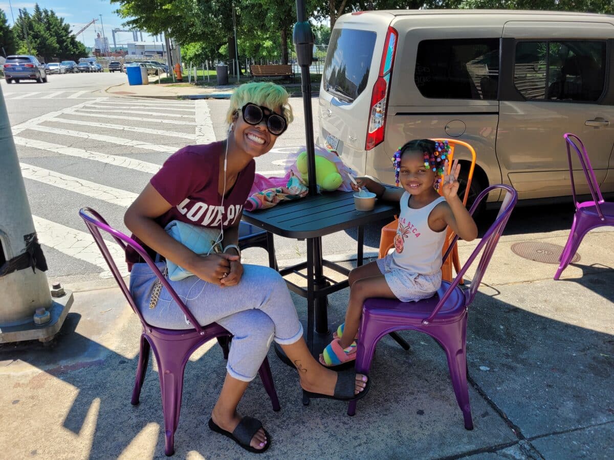 Octavia "Maggie" Bonds and daughter Harley enjoy vanilla ice cream at Ice Queens