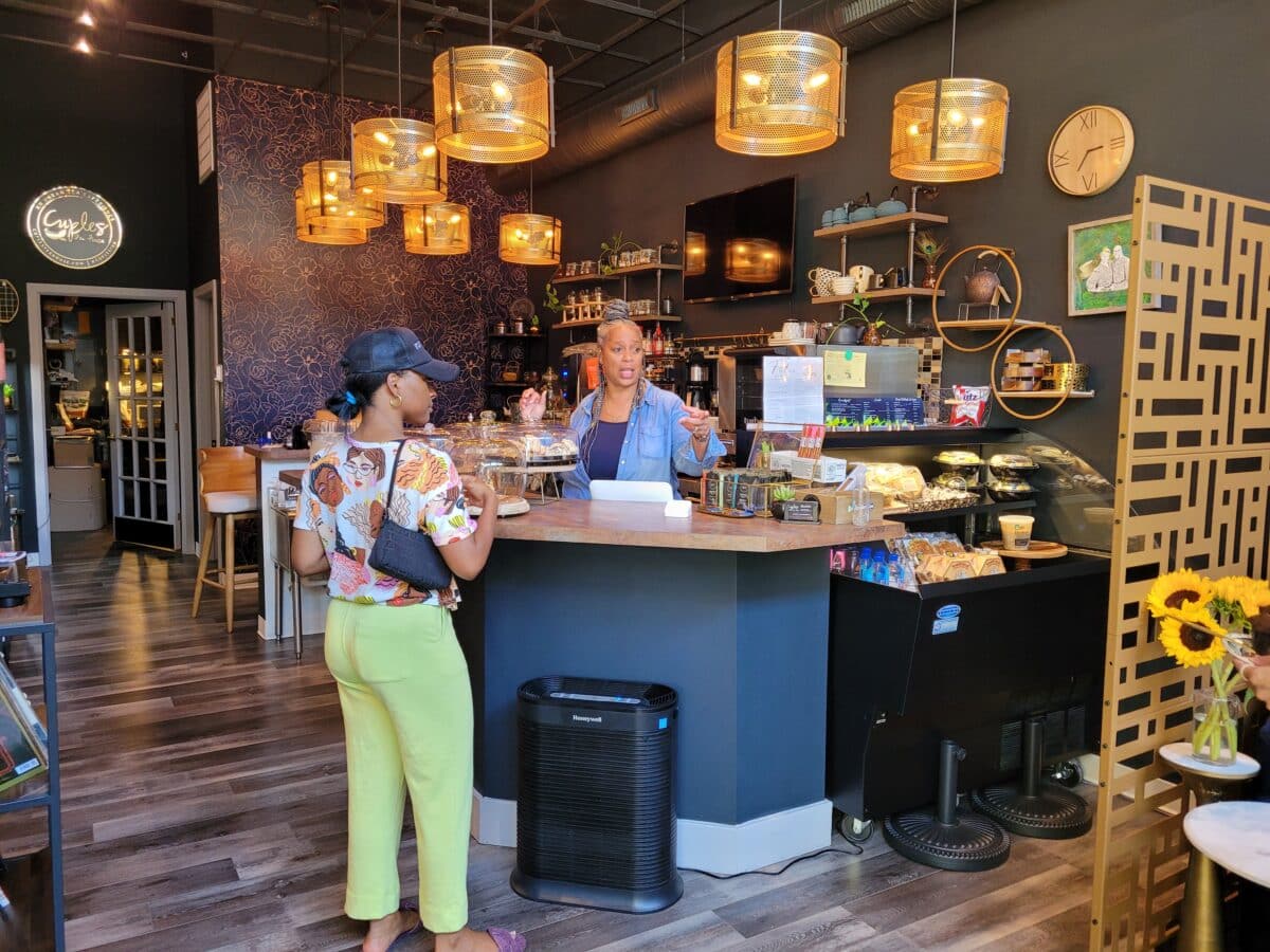 Cuples Tea House -- Lynnette helps a customer