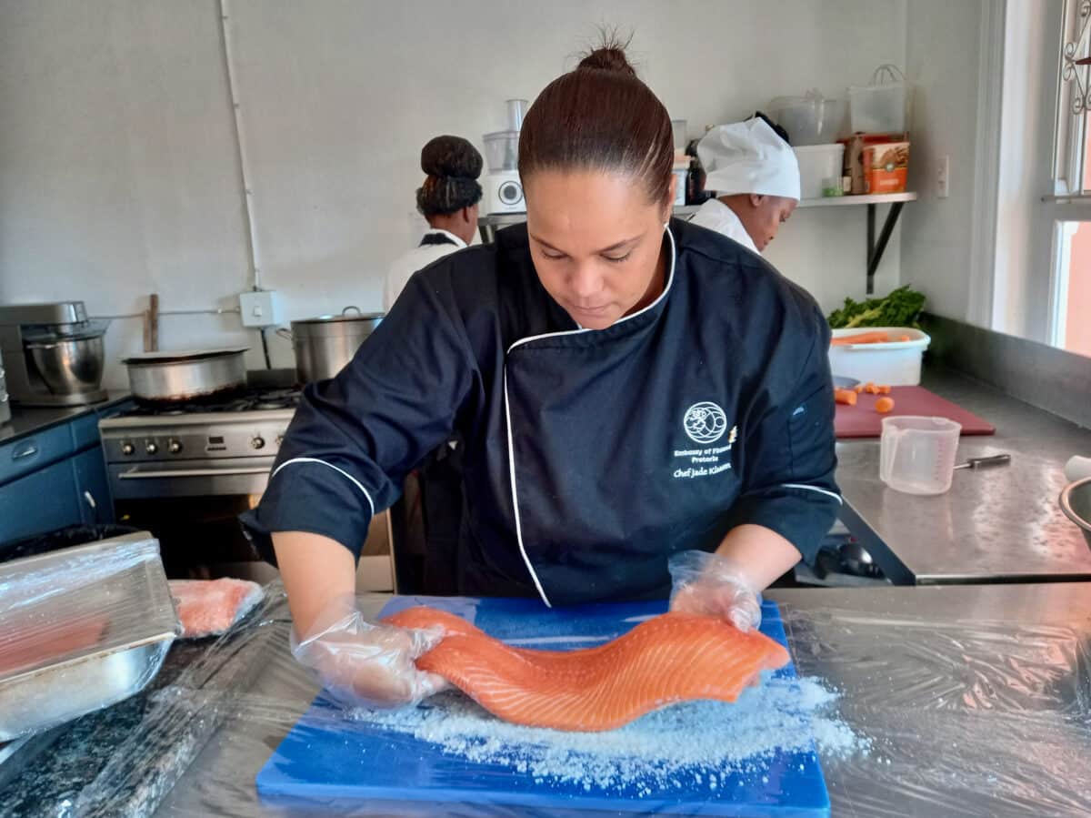 Chef Jade Klaasen curing salmon for Finland's cocktail party for Jomba! dance festival