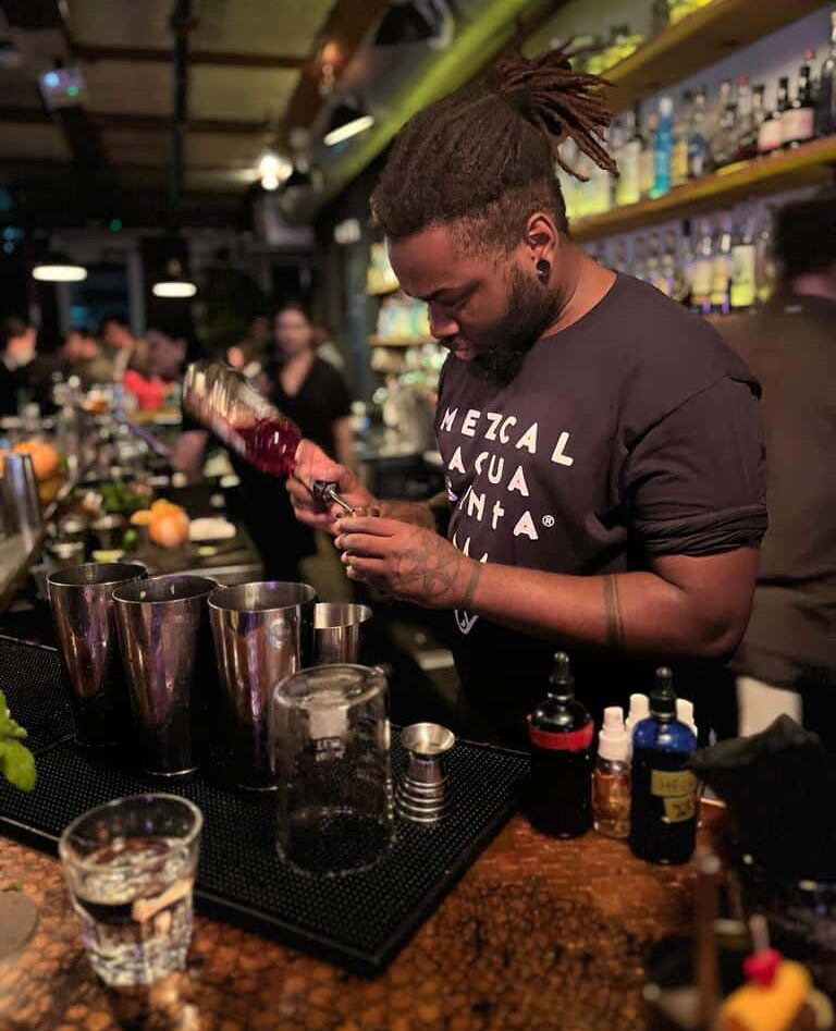 Bartender making at drink at Civil Liberties, dining out in Toronto