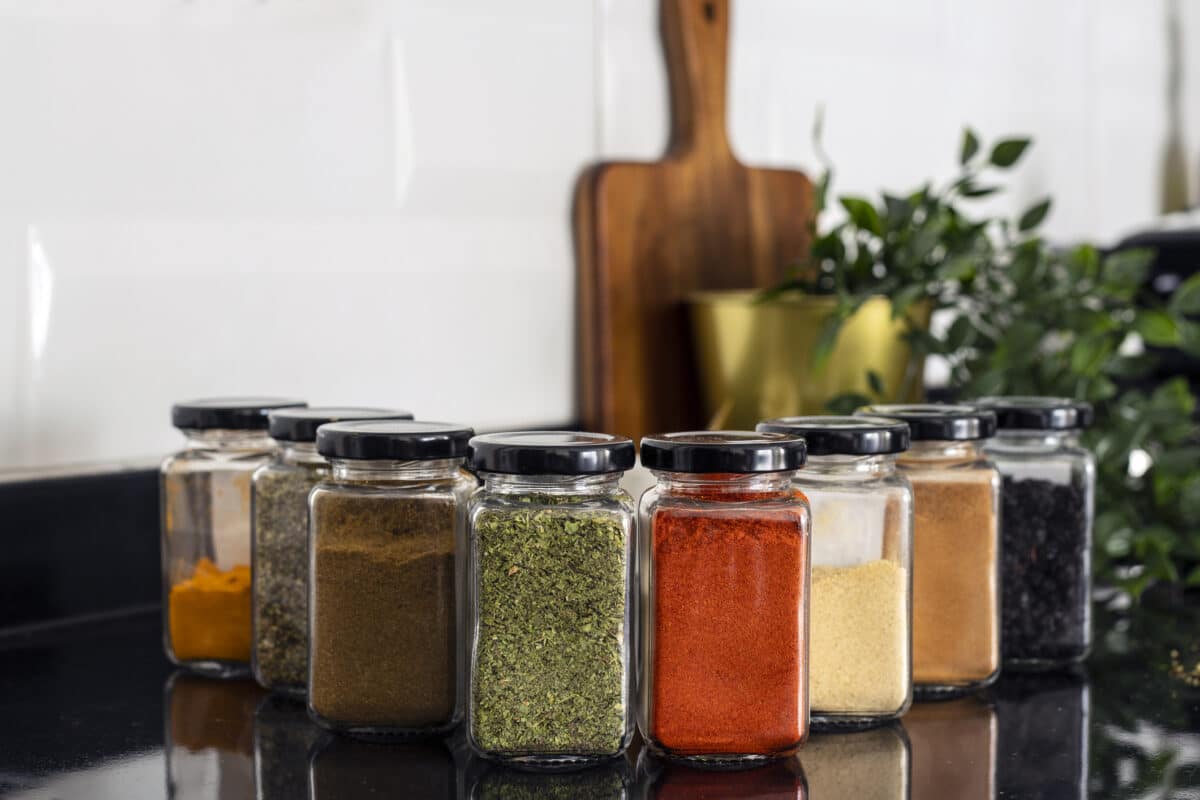 What to do with expired spices - various dried spices in glass jars